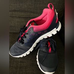 New (with no tags) Reebok sneakers, size 9.5. Dark blue and pink
